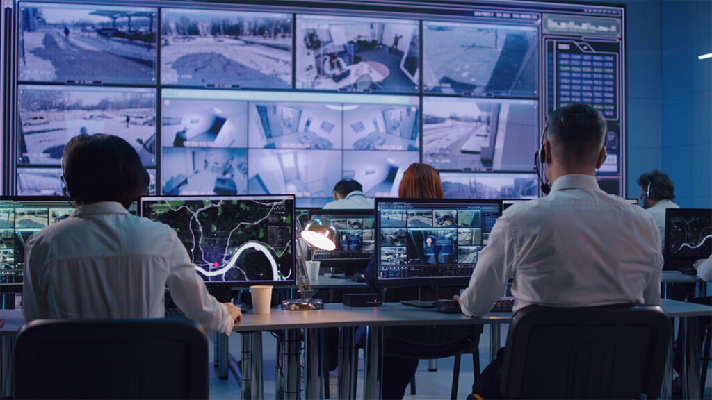 Surveillance team working in office