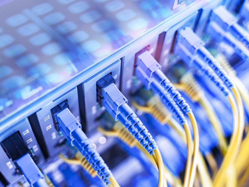Fiber Optical cables connected to an optic ports and Network cables connected to ethernet ports Fiber Optical cables connected to an optic ports and Network cables connected to ethernet ports