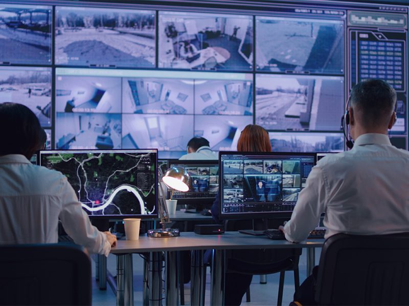 Surveillance team working in office